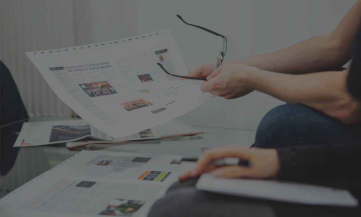 Image of a marketing meeting about a printed piece of work