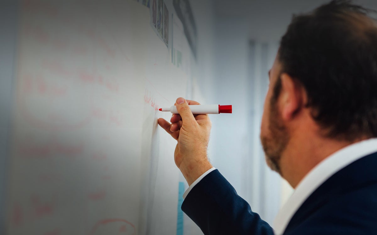 Paul writing on whiteboard