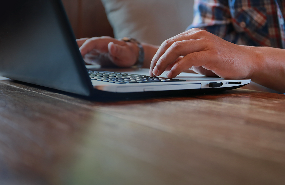 Customer Service typing on laptop