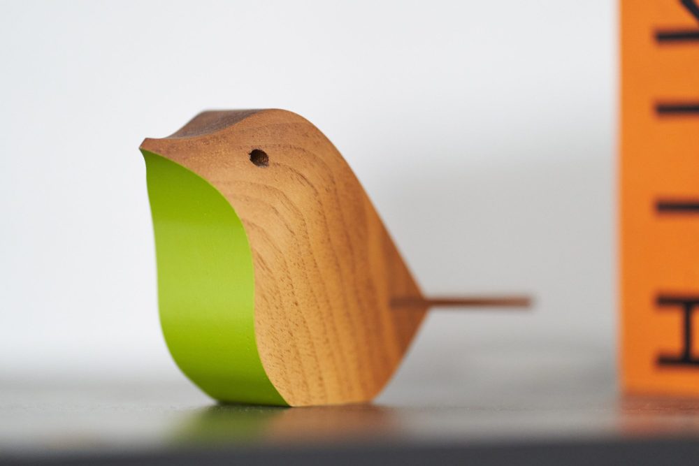 a green wooden robyn - the Ruddocks symbol