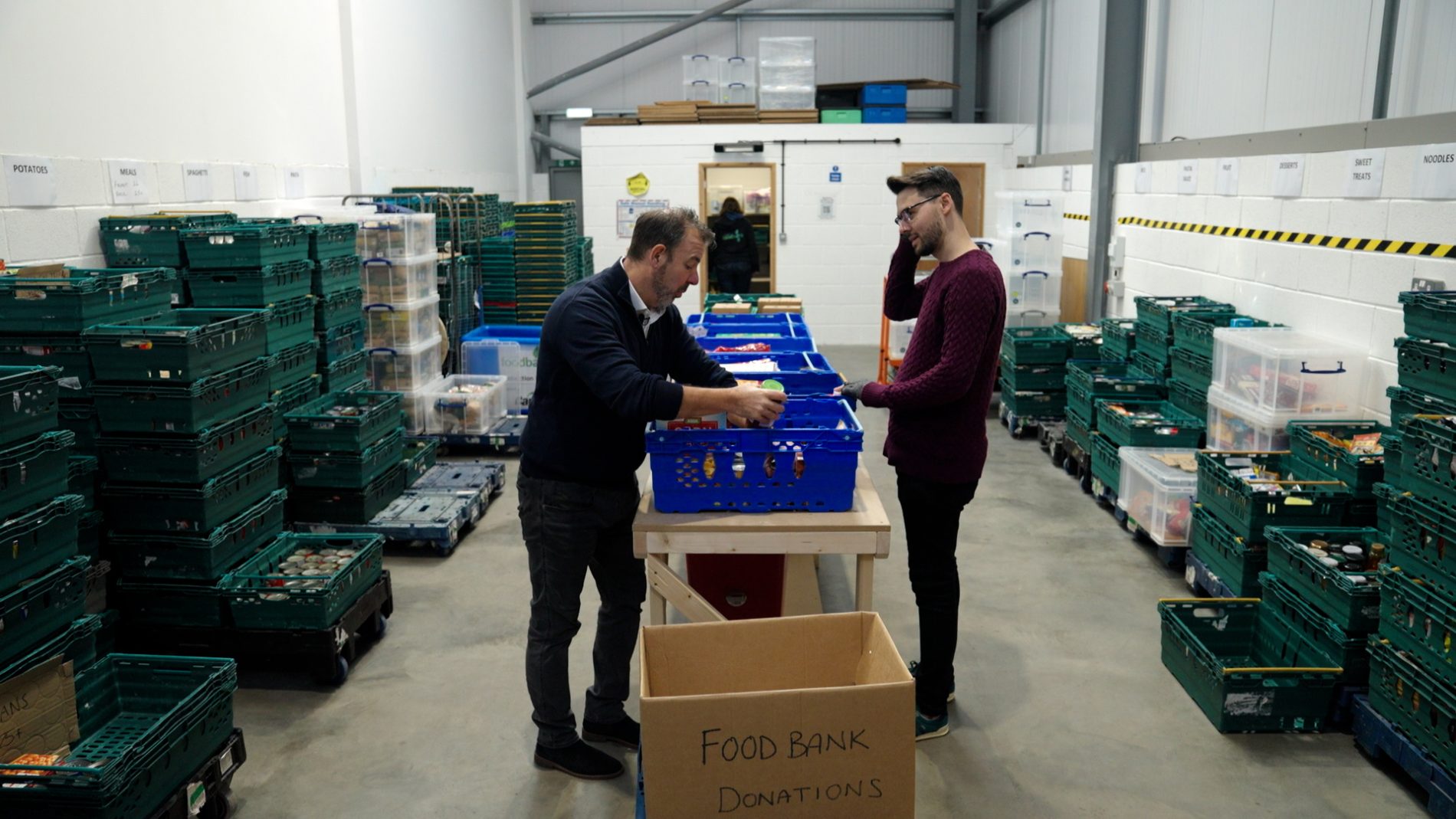 Paul Banton and Ben Cucksey from Ruddocks helping at the Lincoln foodbank as part of Ruddocks' charitable giving initiatives