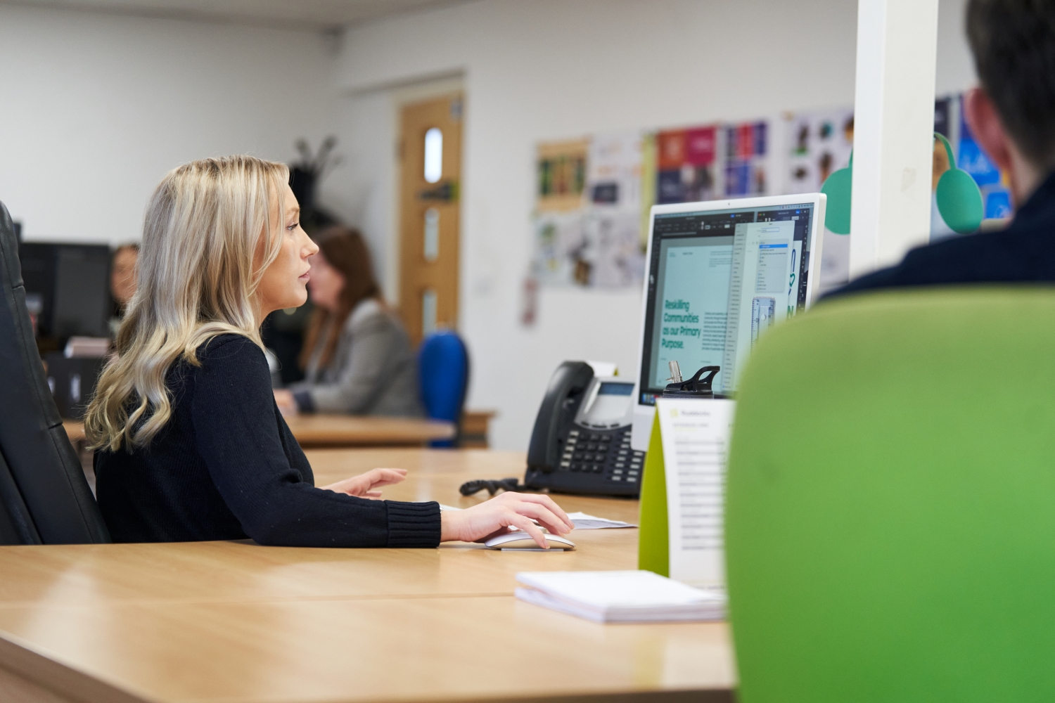 how to use AI well in marketing; a woman looking at a computer